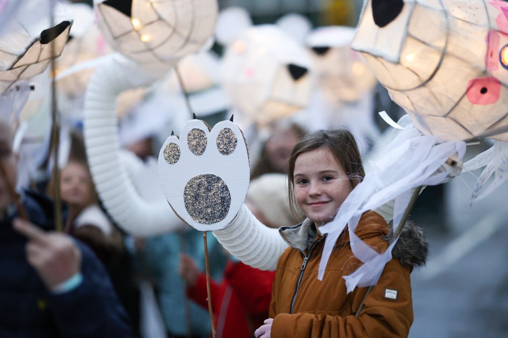 Children light up the streets in the annual Lantern Parade