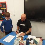 Matt Goodfellow, Poet signing students books.