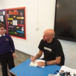 Matt Goodfellow, Poet signing students books.