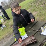 Student working with twigs.